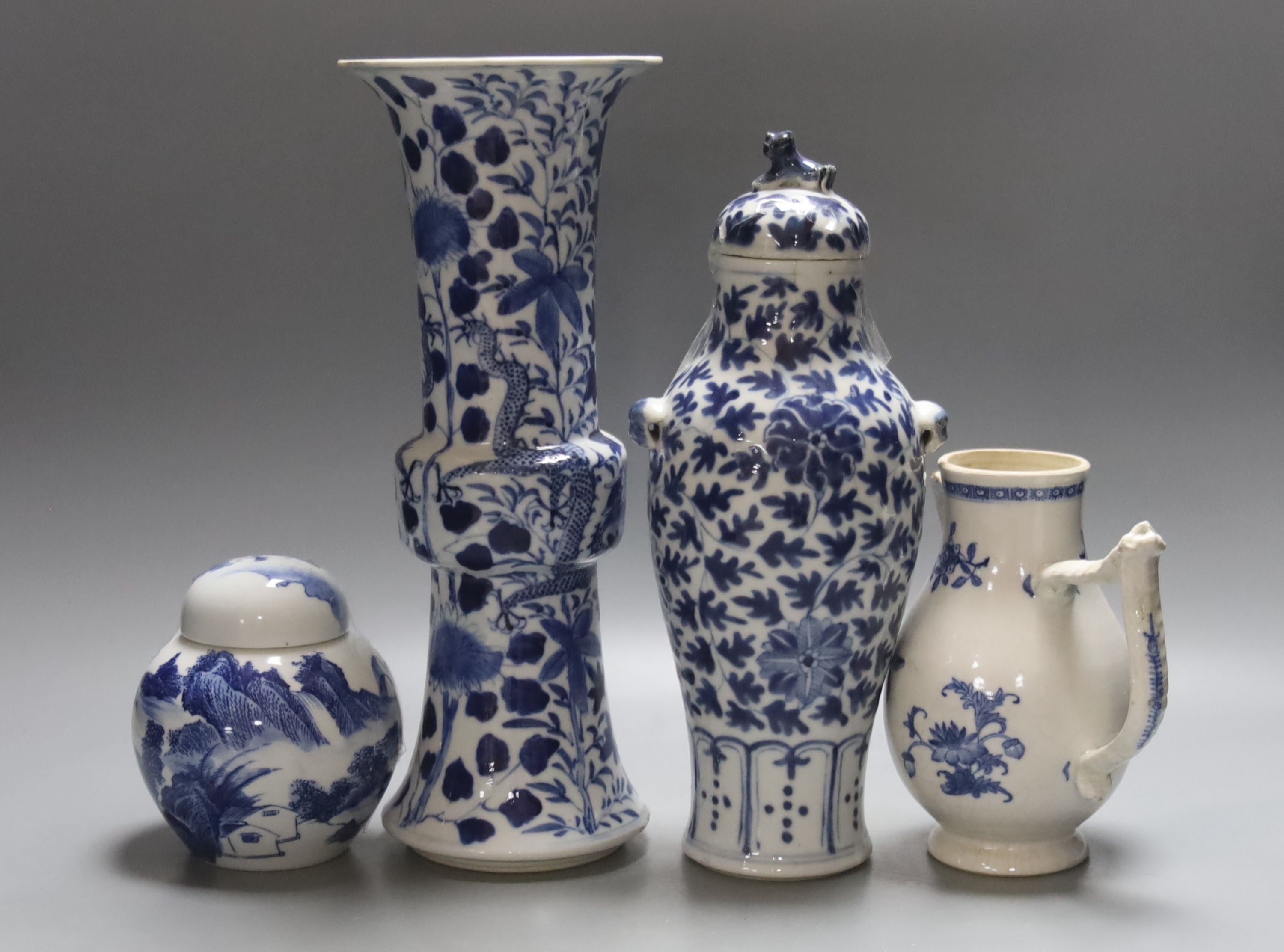 Two 19th century Chinese blue and white vases, an 18th Century blue and white jug and a later jar and cover, tallest 30cm